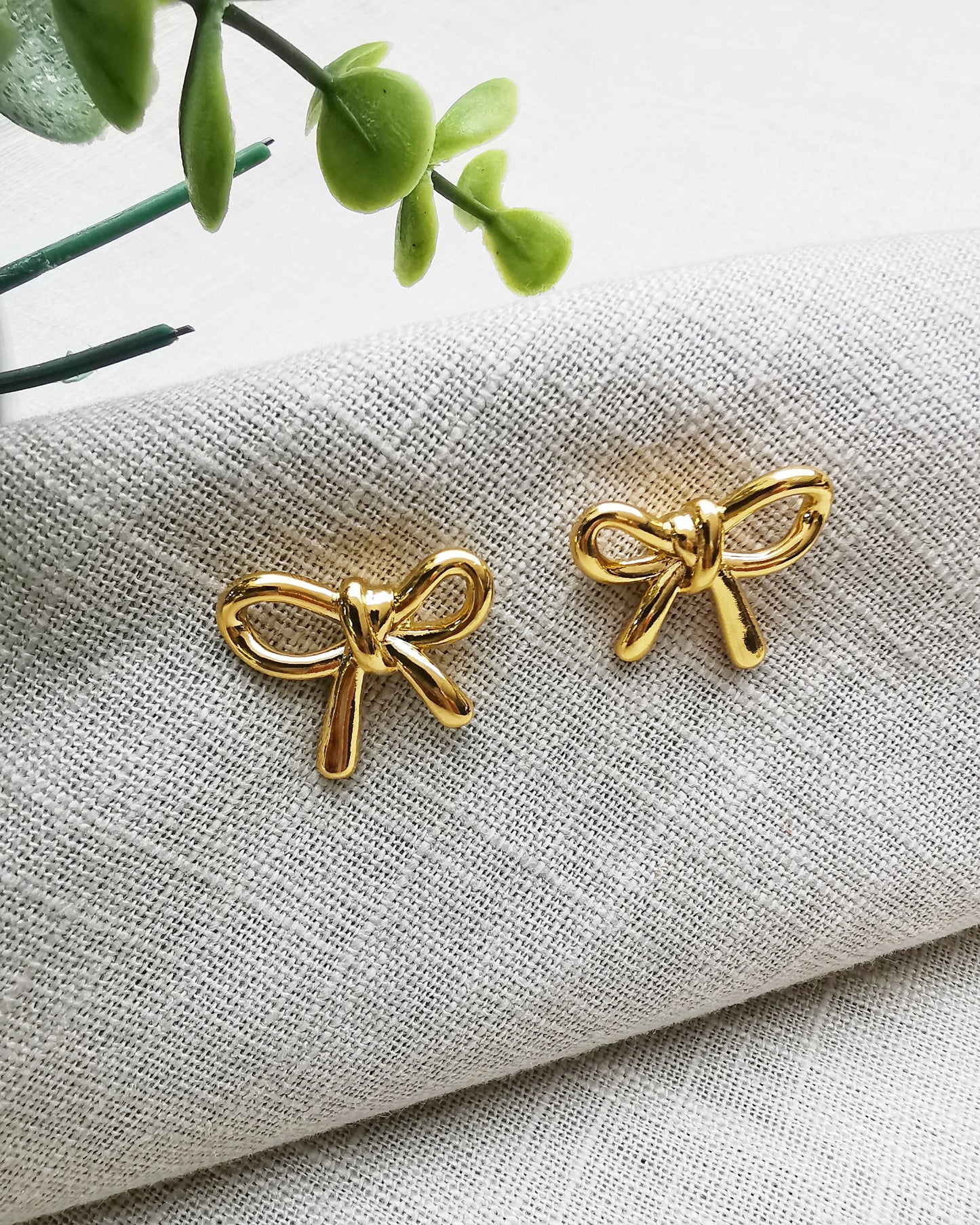 Gold Bow Stud Earrings.