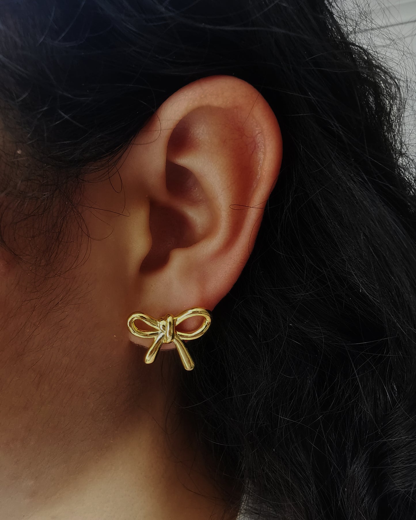 Gold Bow Stud Earrings.