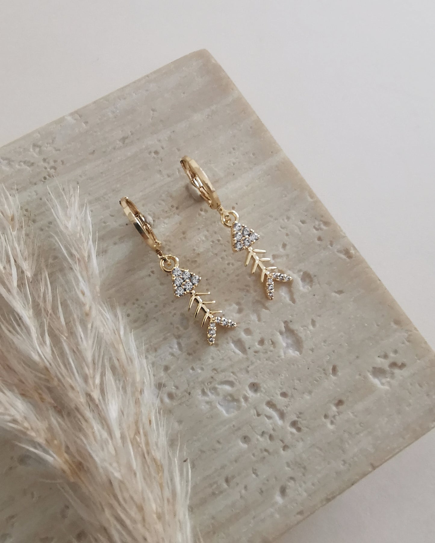 Fish Bone Charm Earrings with Cubic Zirconia Accents.